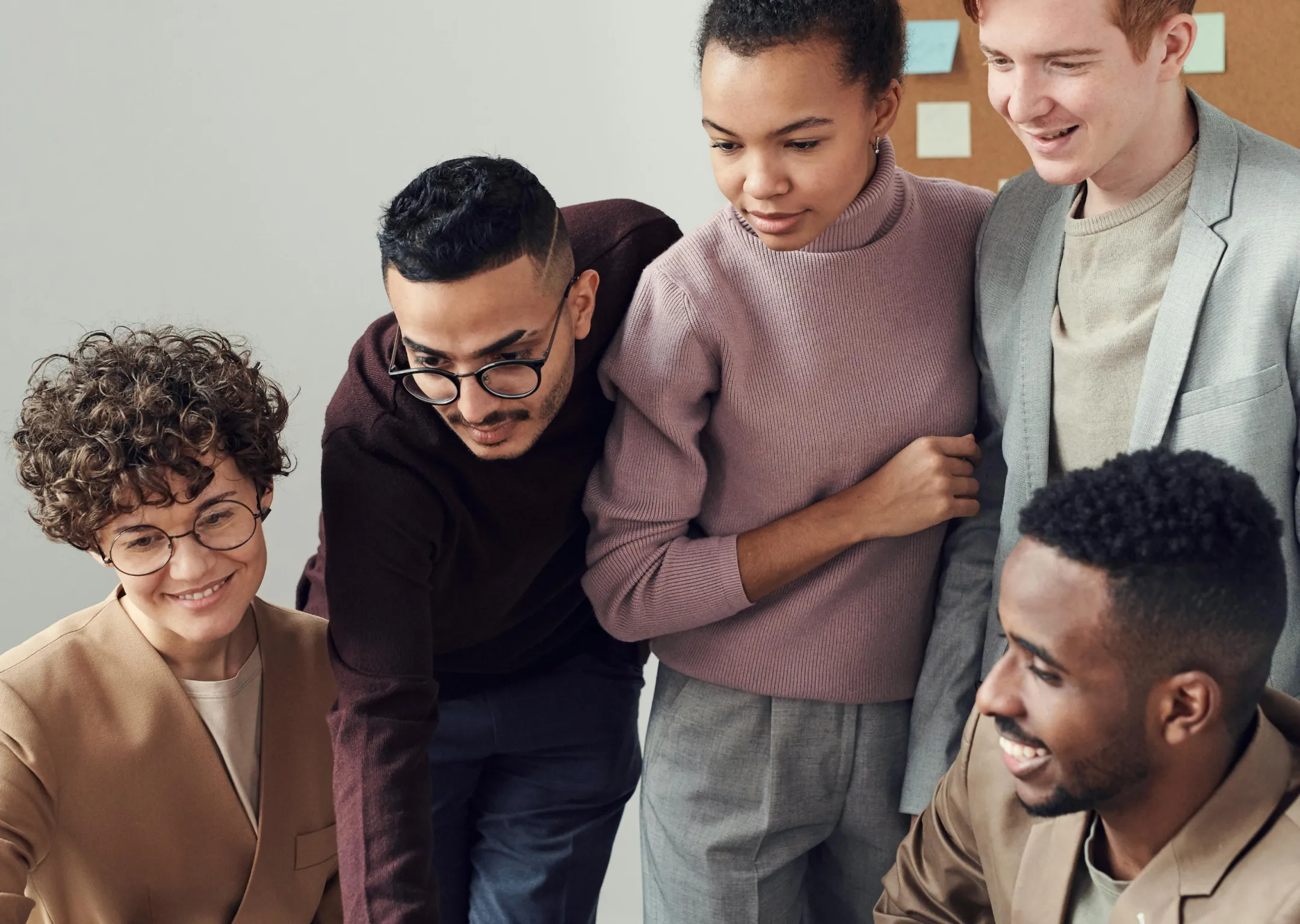 A group of people all looking at one thing.