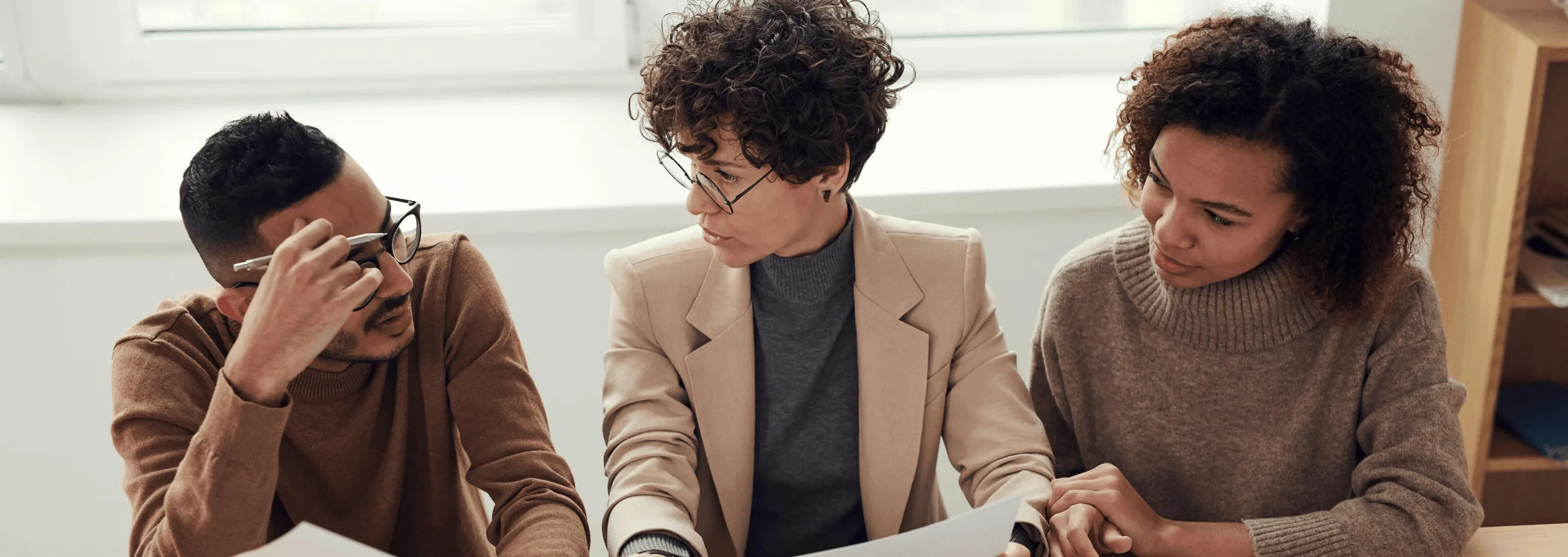 An image showing three people simply talking to each other.