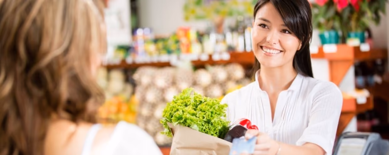 Shopping woman at the checkout paying by card-782986-edited