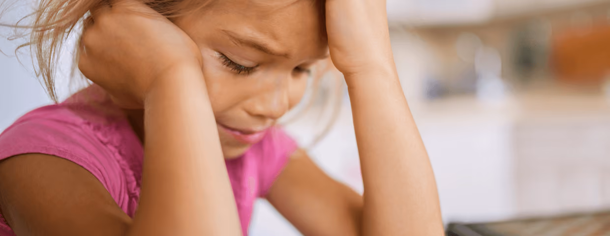 Young girl experiencing symptoms of PTSD