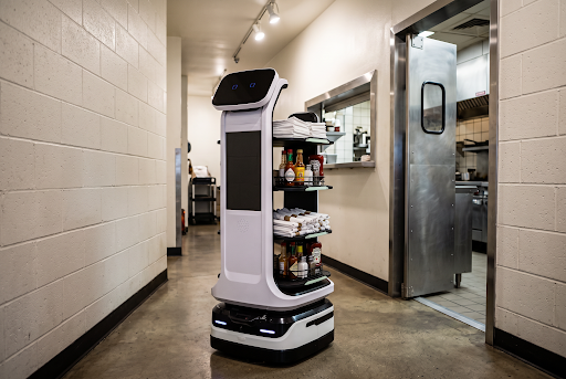 SIM-E autonomous food runner robot delivering meals in a restaurant