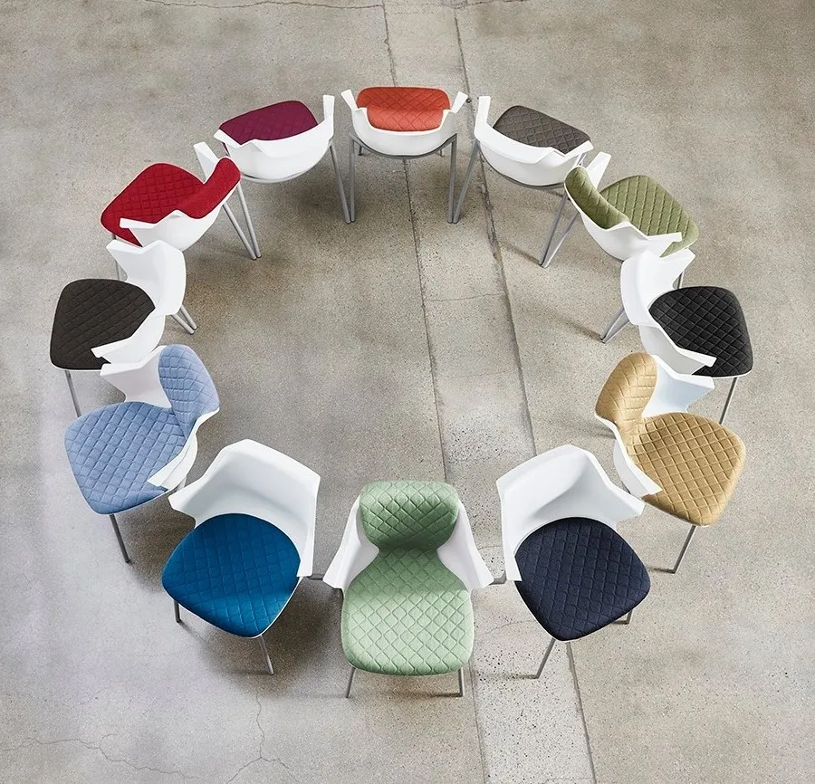 A circle formed by twelve colorful chairs