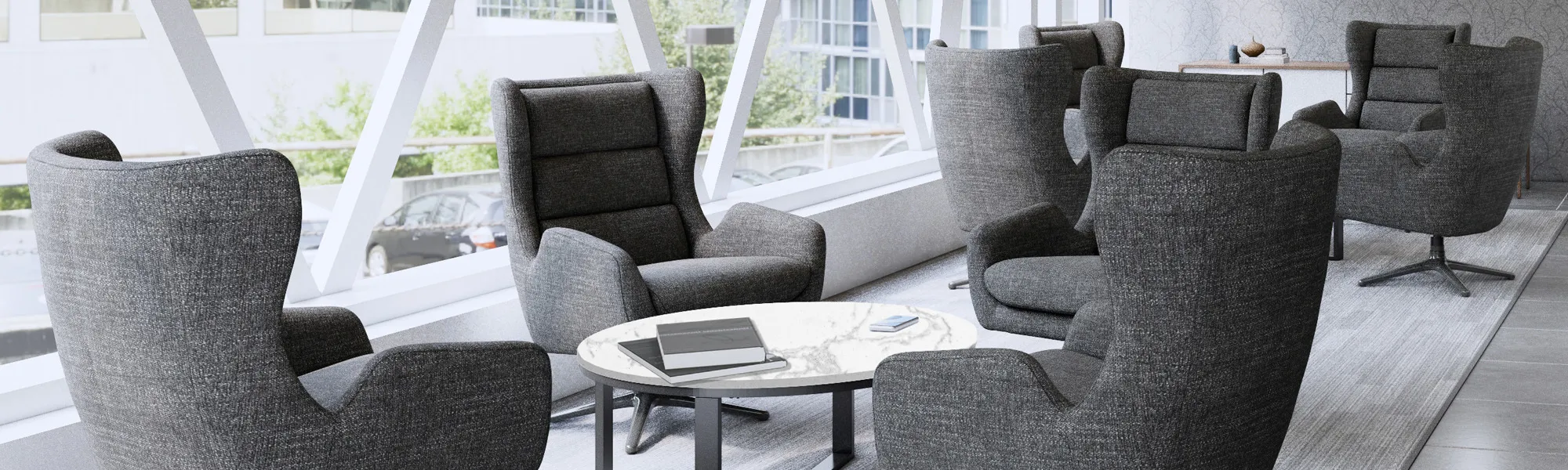 A black chair with a table in front of it.