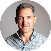 Testimonial image of a business professional giving feedback on Allthings services.