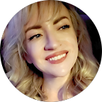 Smiling woman with blonde hair and light makeup in bright lighting.