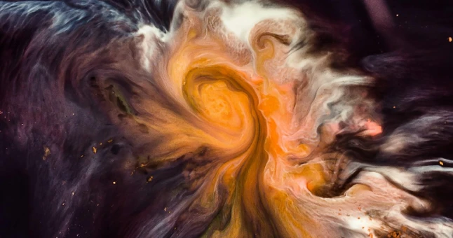 Abstract swirling pattern of orange, white, and dark colors creating a fluid, smoke-like effect.