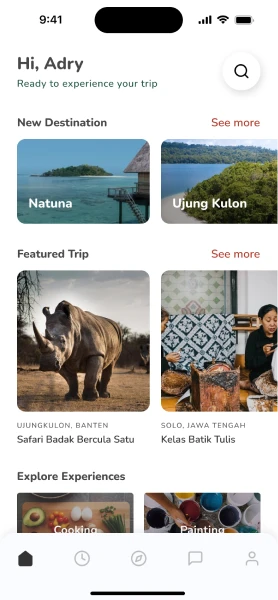 Mobile app home screen showing greeting 'Hi, Adry,' with sections for New Destinations featuring Natuna and Ujung Kulon, and Featured Trips including Safari Badak Bercula Satu and Kelas Batik Tulis.