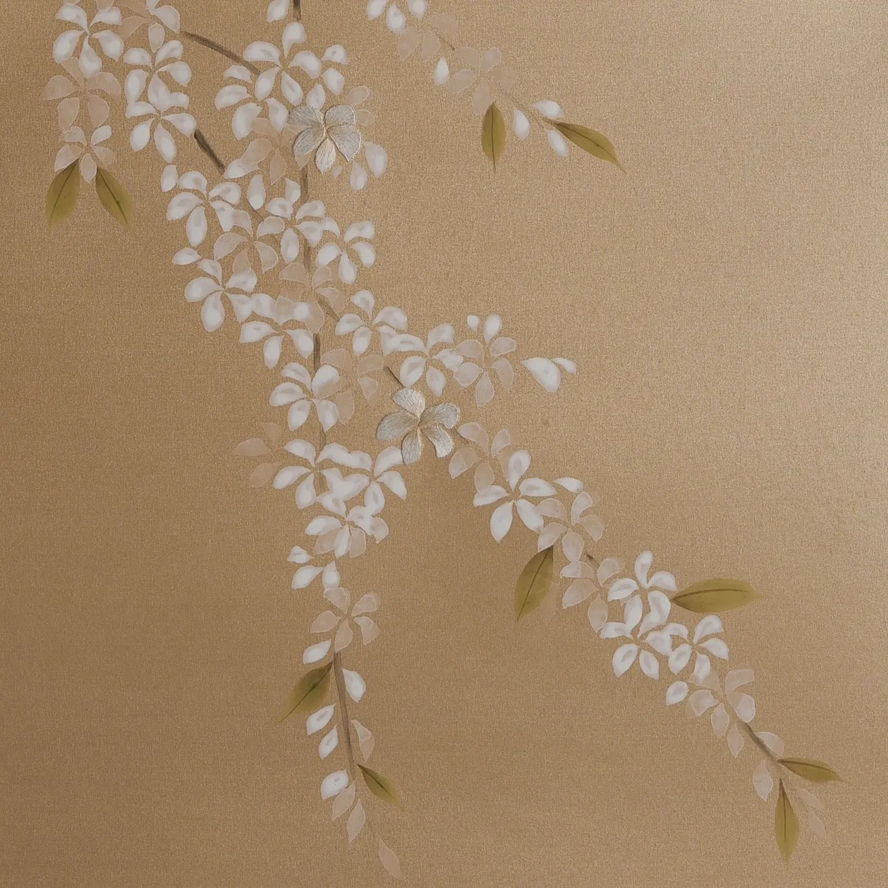 Detail of Blossom Canopy Chinoiserie hand-painted wallcovering in Golden showing arcing cherry blossom branches with optional embroidery by Stang Design.