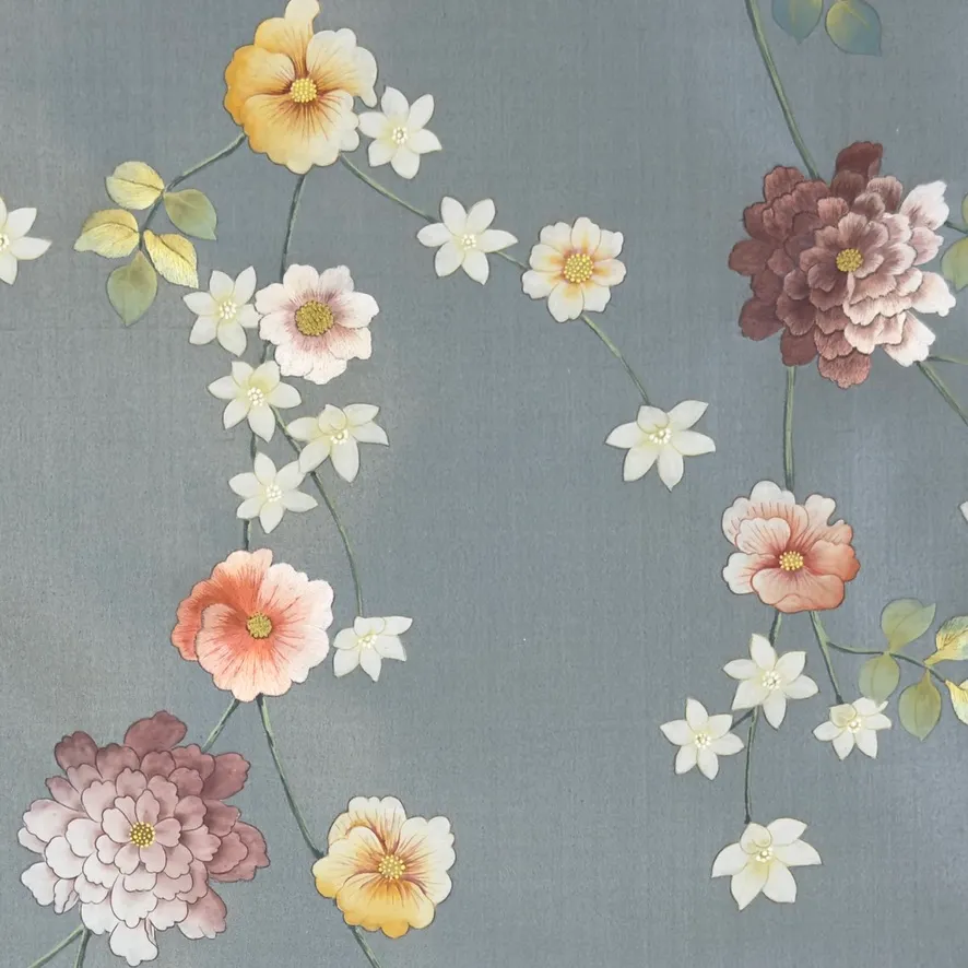 Detail of Caprice Chinoiserie hand-painted wallcovering in Provence showing three different blooms on a single trailing stem.