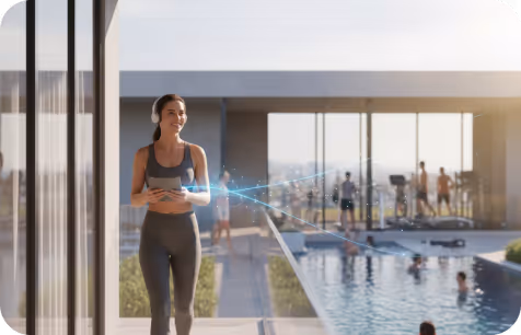 A couple relaxing on a couch in a modern living room, watching a Netflix documentary about a whale on TV.