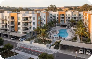 Modern apartment complex with pool, showing communities served by leading internet companies like Gigstreem.