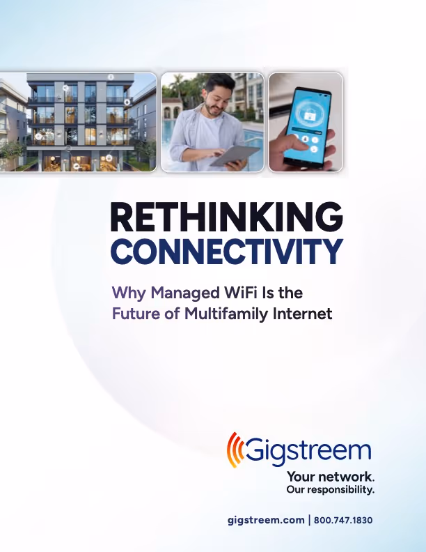 Advertisement showing a residential building, a man using a tablet, and a smartphone with a WiFi lock icon, titled 'Rethinking Connectivity: Why Managed WiFi Is the Future of Multifamily Internet' by Gigstreem.