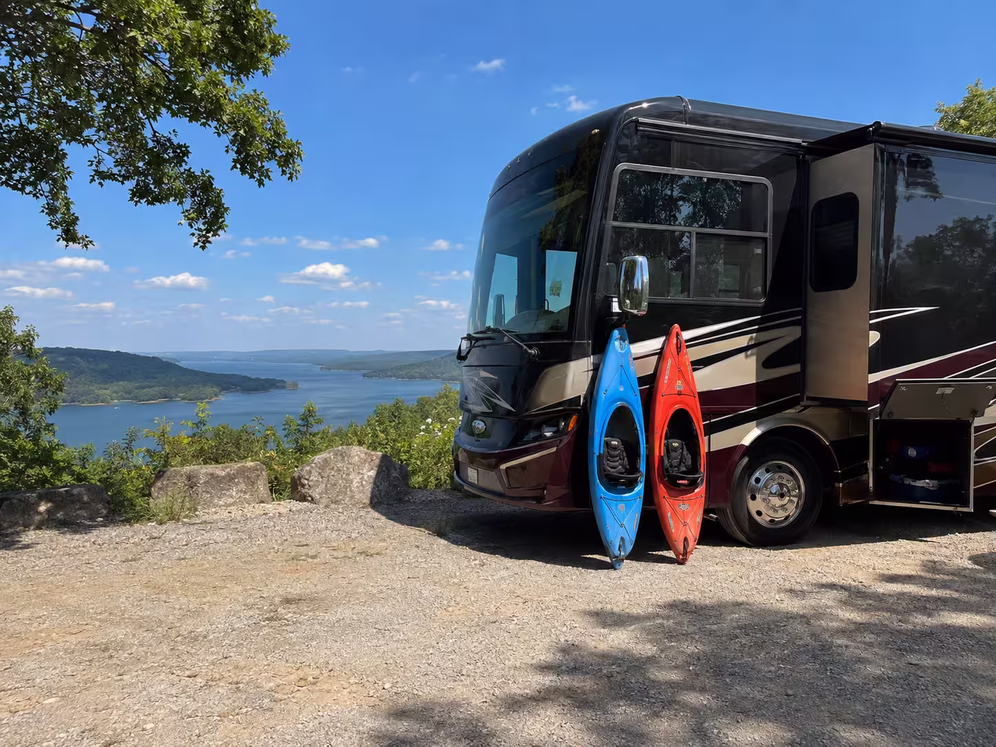 Luxury RV with kayaks at a Table Rock Lake overlook near Branson