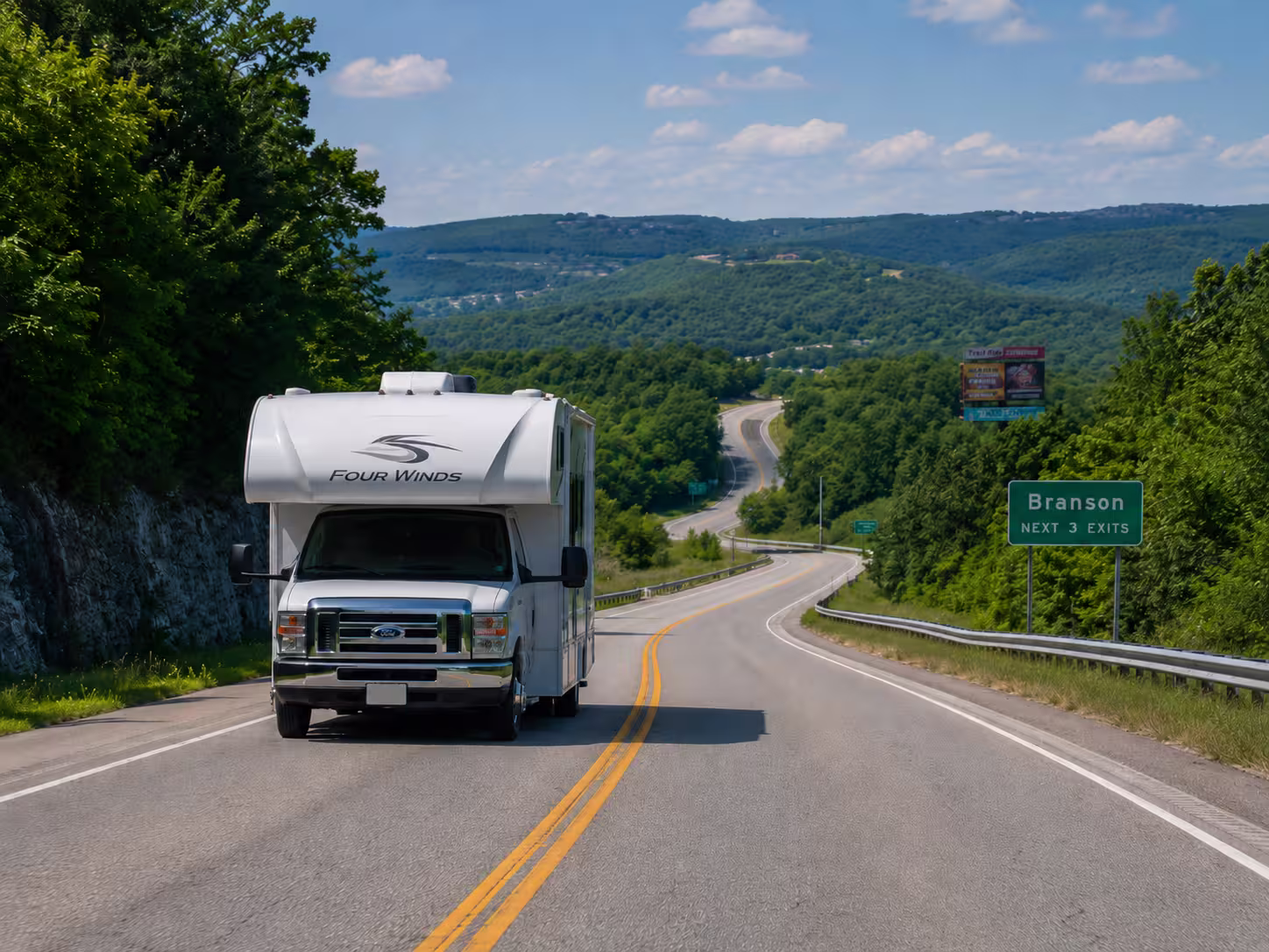 Class C motorhome driving Ozark hills toward Branson