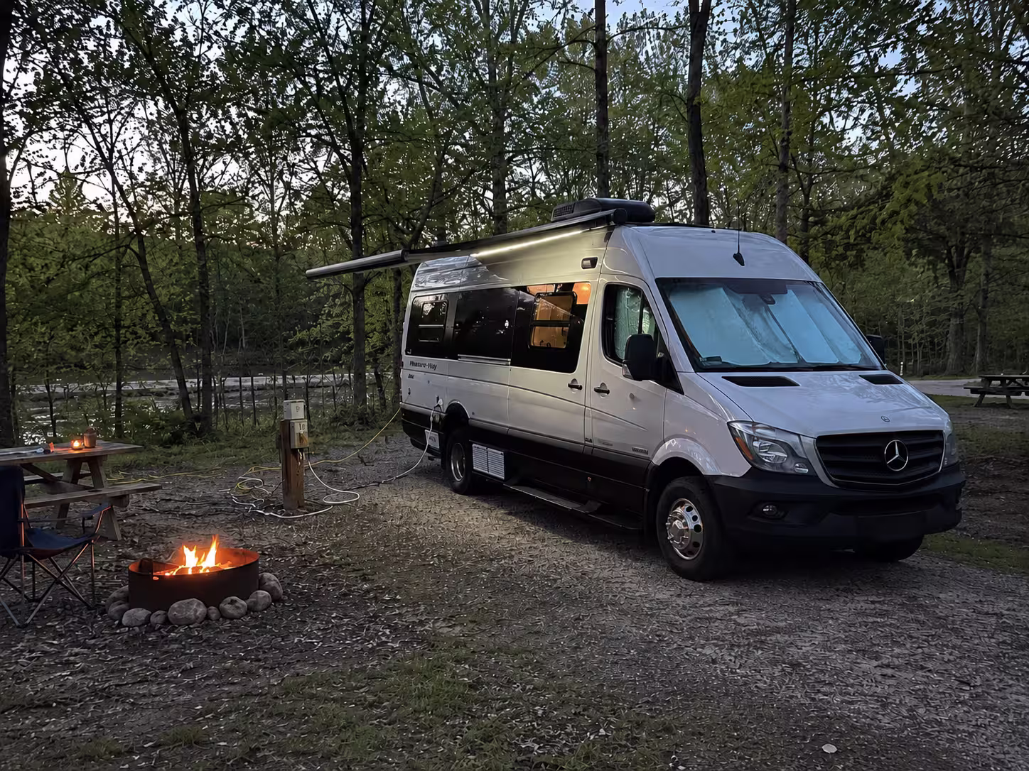 Class B camper van at wooded campground near Marshfield, Missouri