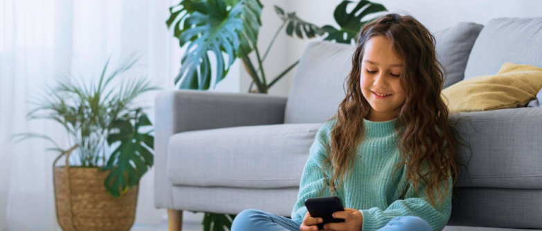 Girl Baby Using The Mobile Phone