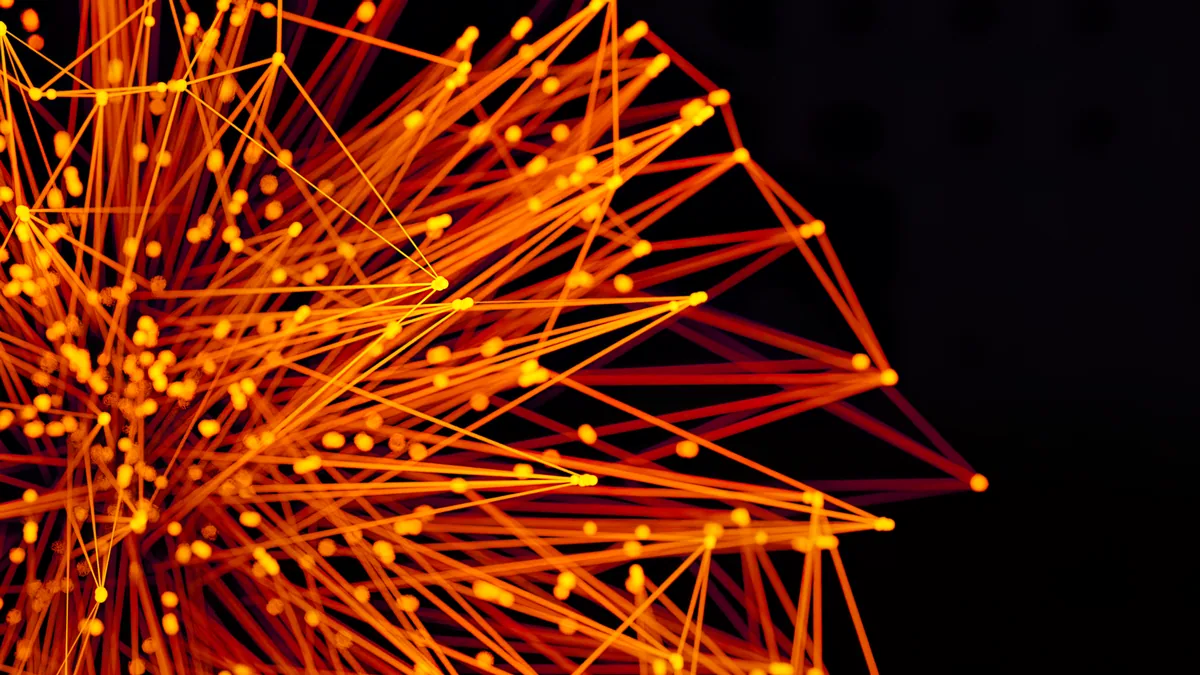 Lignes et points orange formant un réseau abstrait, illustrant le classement des meilleures agences de netlinking en France