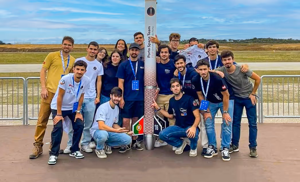 members of the Porto Space Team, a student-led initiative from the University of Porto, gathered around a rocket