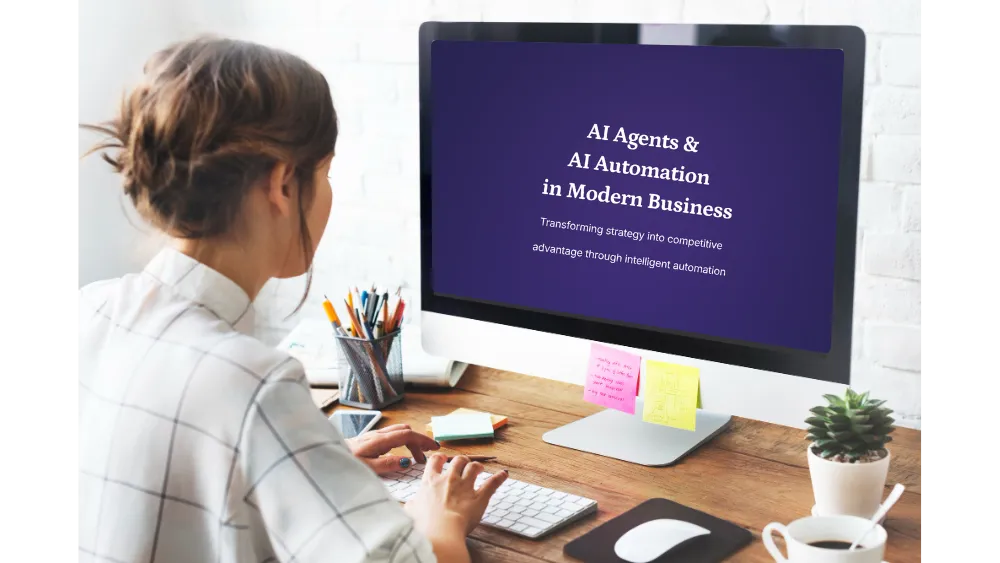 Person typing at desk with computer screen displaying 'AI Agents & AI Automation in Modern Business' and a small potted plant nearby.