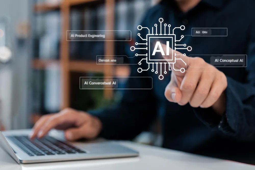 Person using a laptop with a digital interface showing a central AI chip icon connected to terms like AI Product Engineering and AI Conceptual AI.