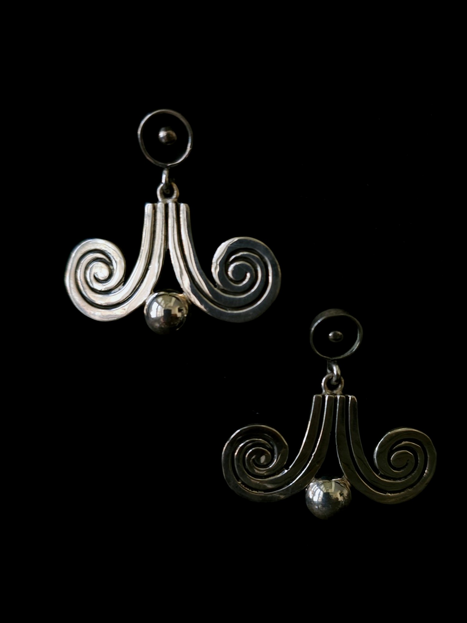 Scroll drop earrings with a ball