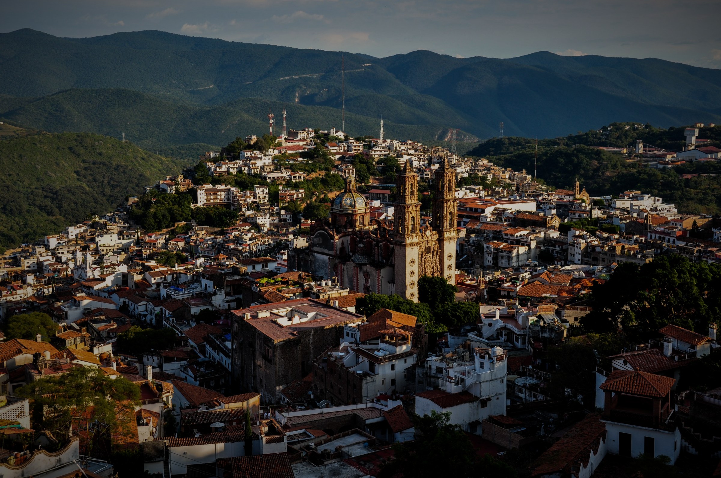 Aerial view of Santa Prisca and Taxco at golden hour