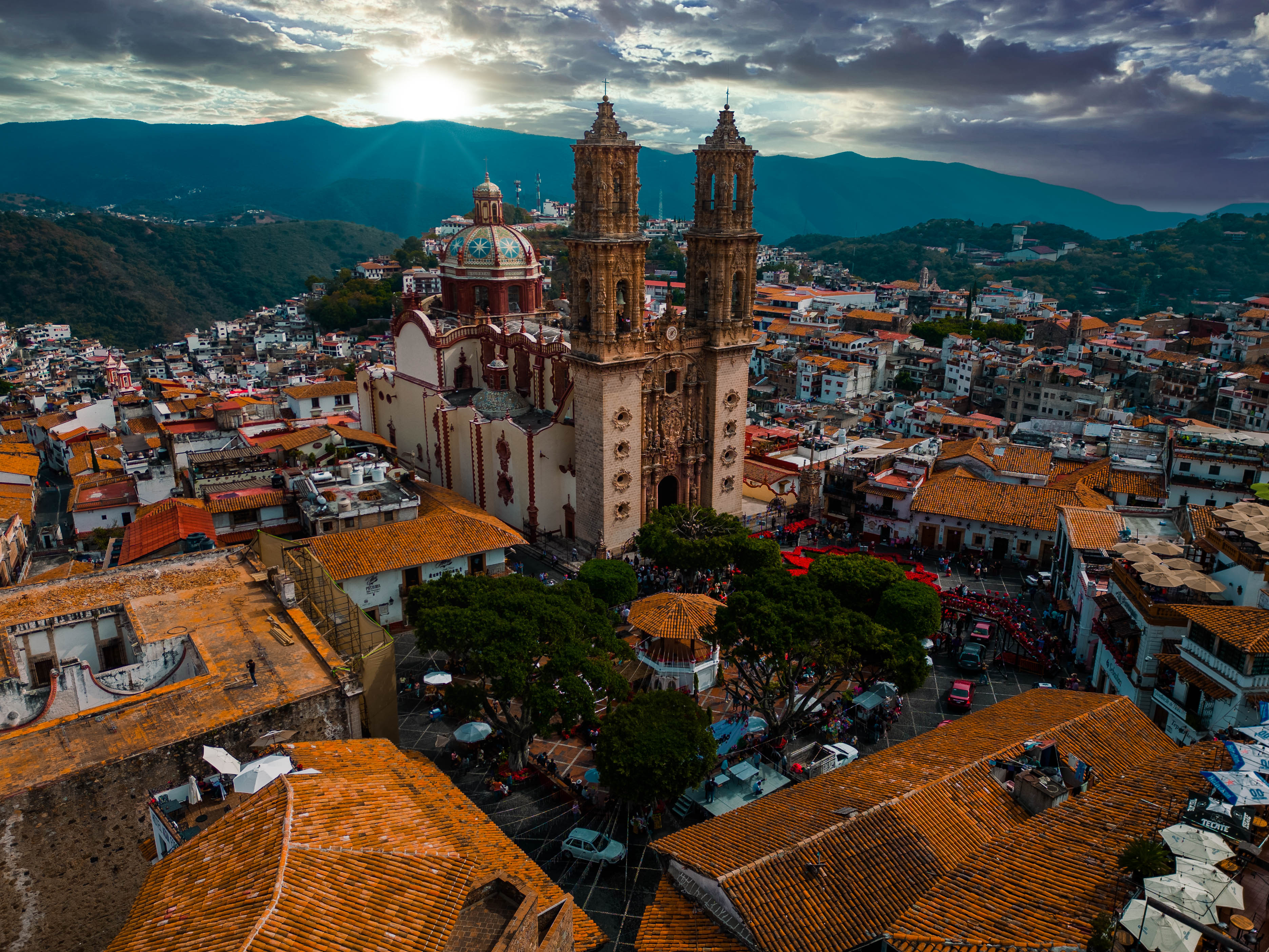 Santa Prisca plaza in Taxco at dusk with light trails