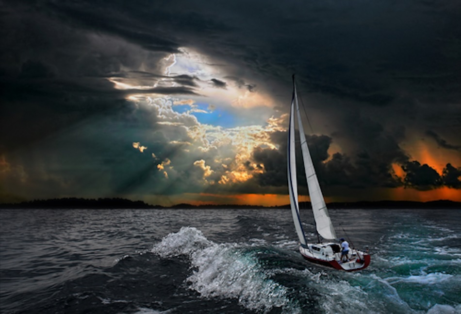 Sailing boat sailing through a storm