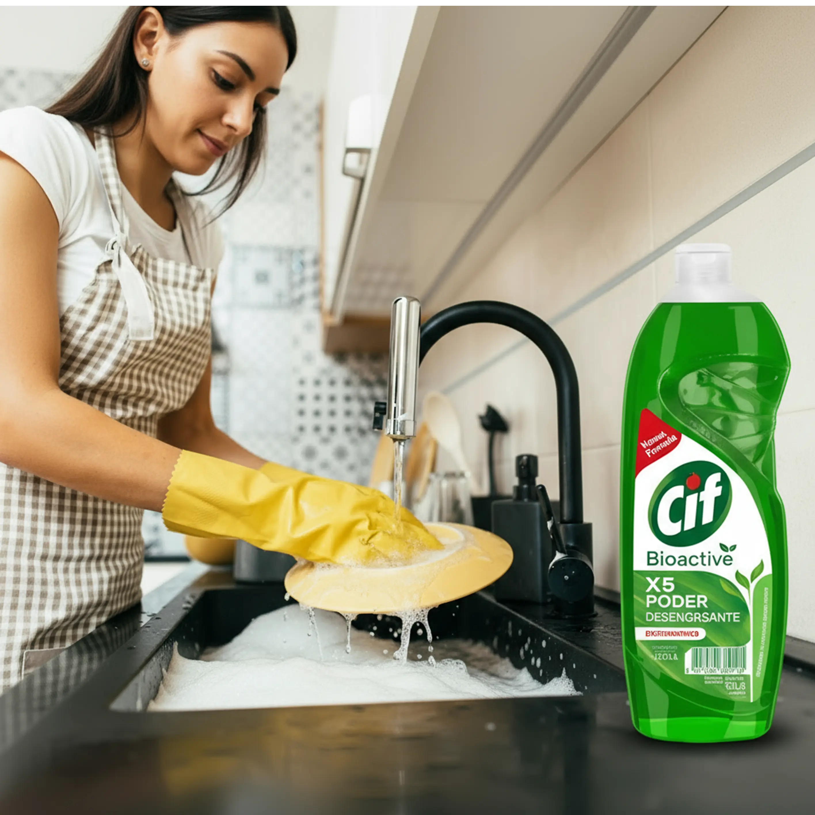 Woman wearing yellow gloves washing a yellow plate with running tap water in a kitchen sink next to a bottle of Cif Bioactive dishwashing liquid.