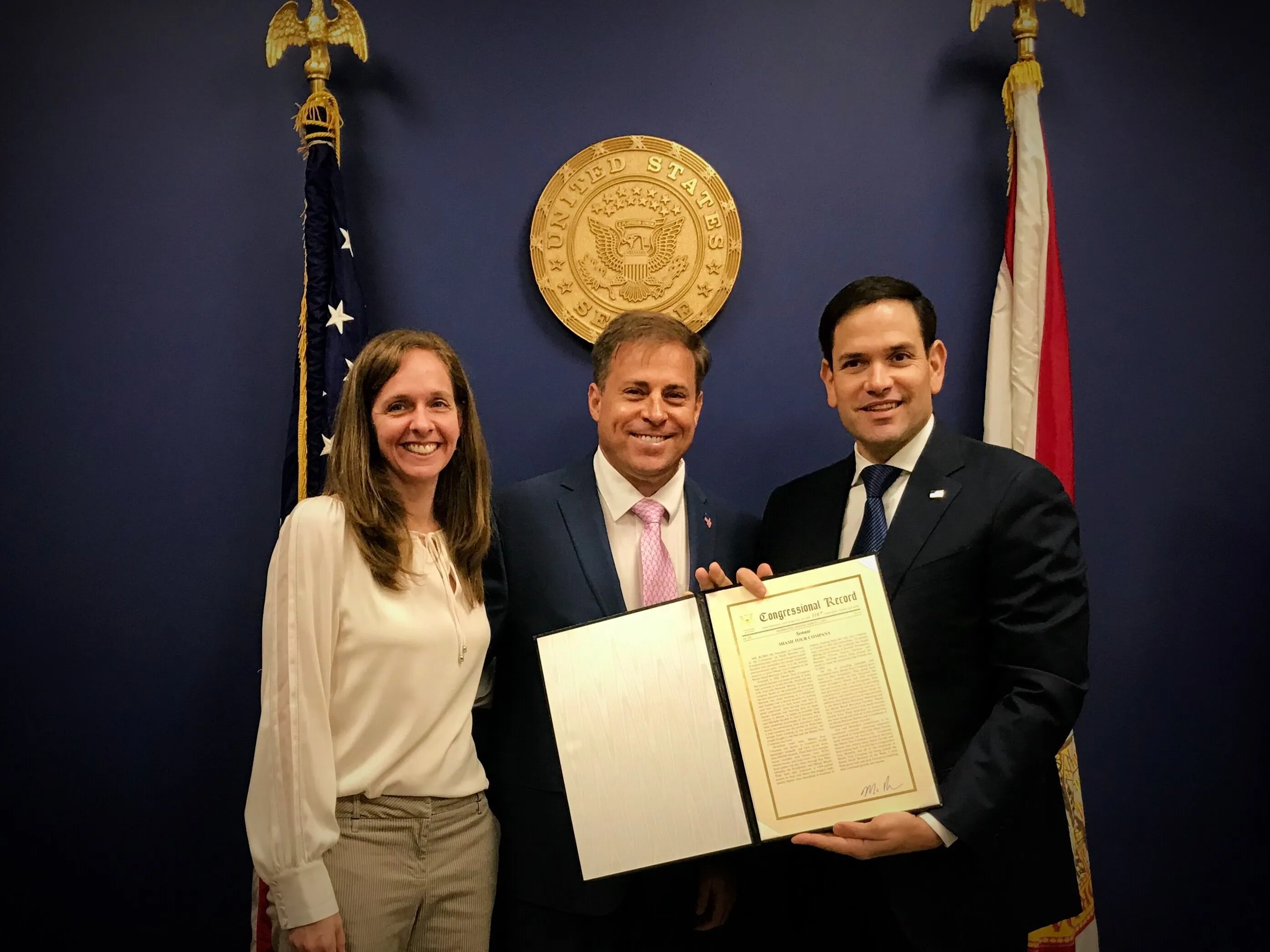 Michelle & Gus Moore with Florida Senator Marco Rubio, receiving an “Outstanding Service” award from the U.S. Senate Committee on Small Business and Entrepreneurship.