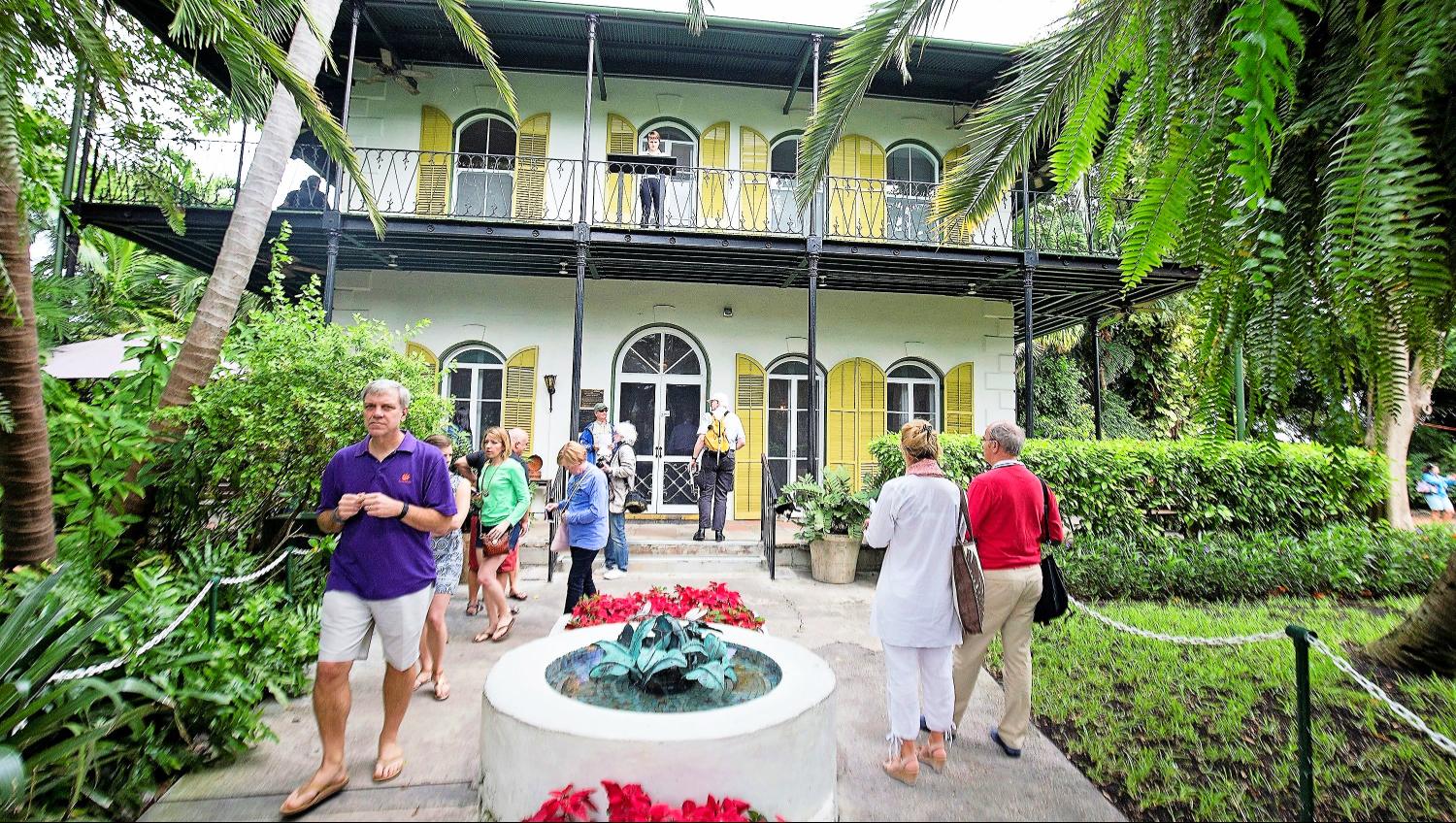 Tour group outside the Ernest Hemingway's home in Key West.