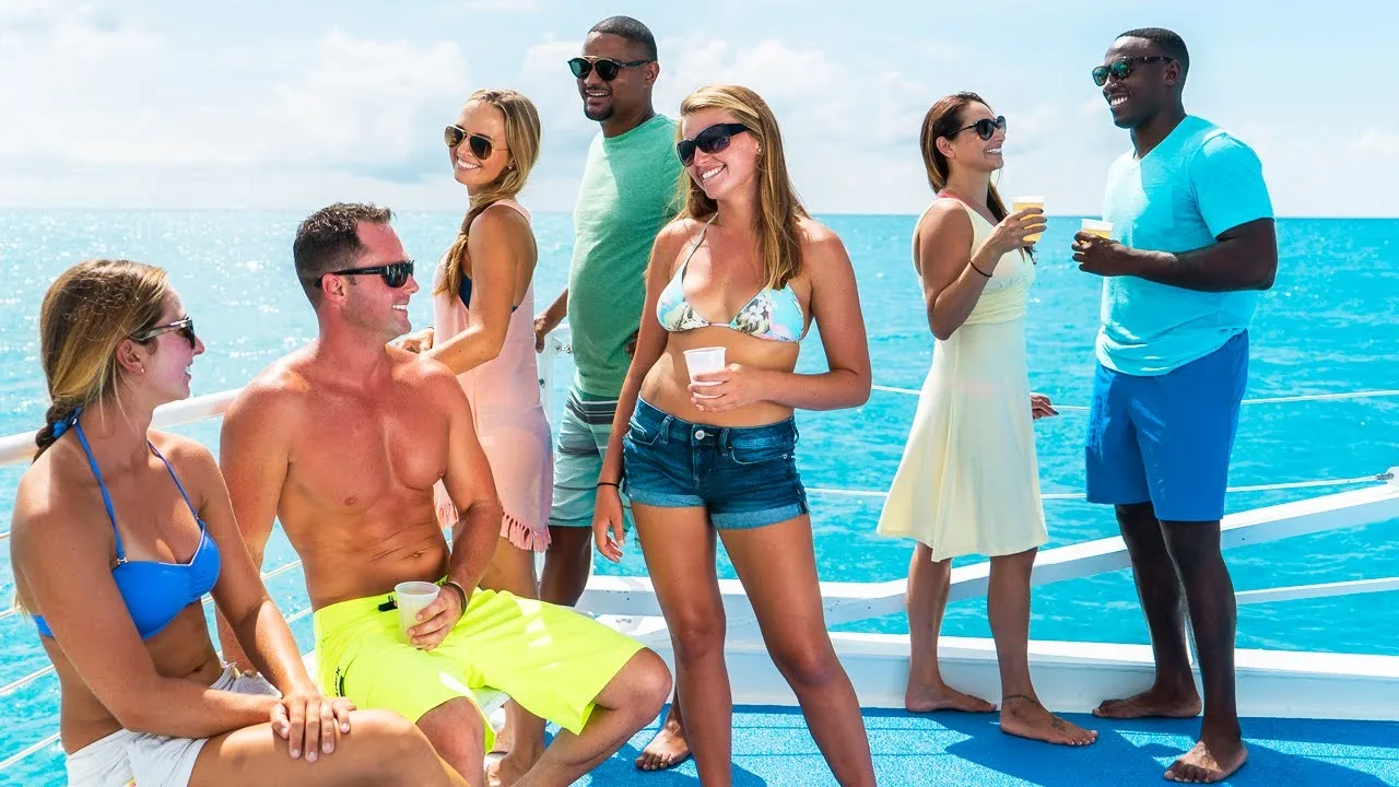 Three girls in bikinis suntanning on the boat.