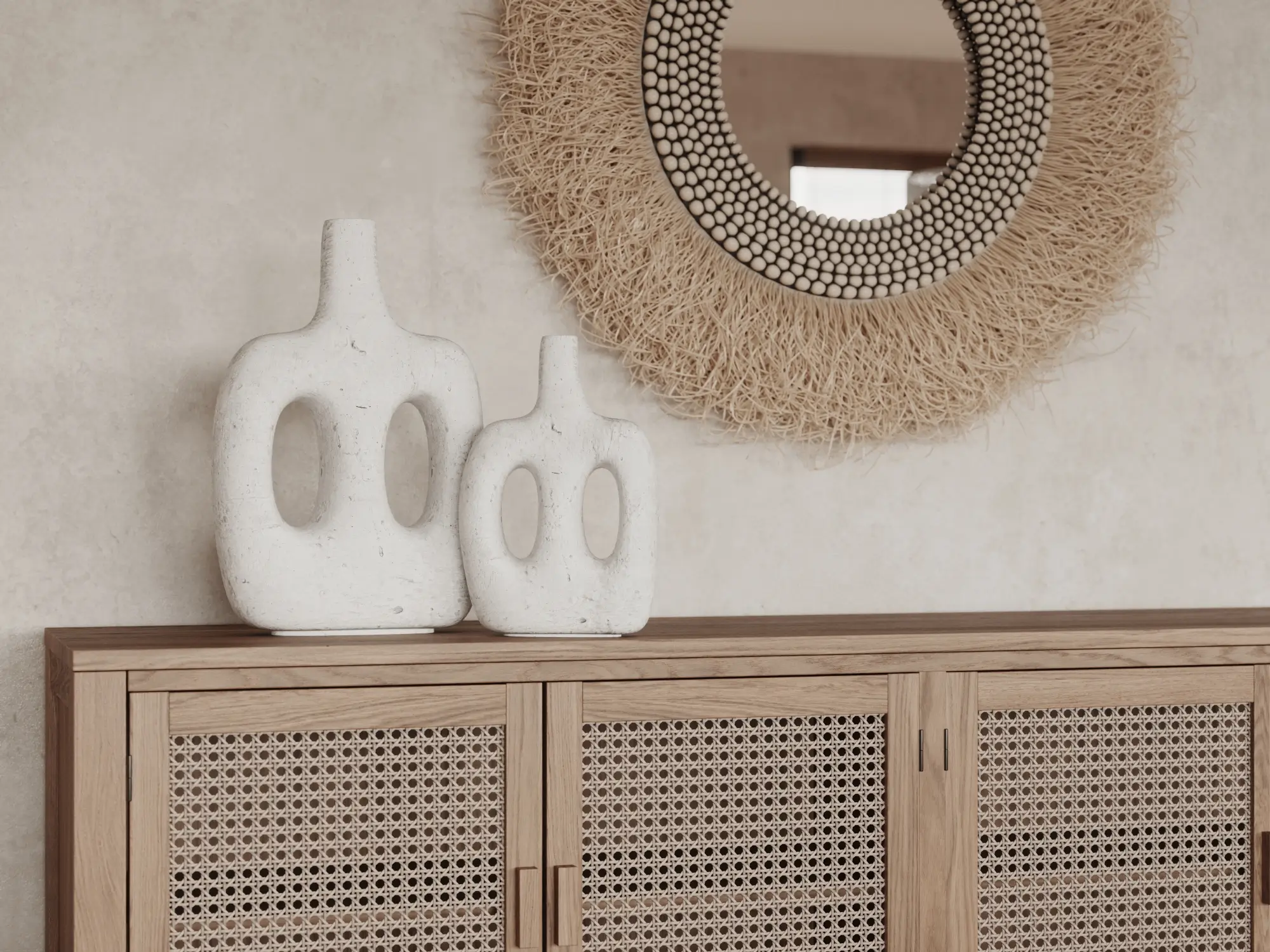 Białe wazony ceramiczne o organicznych kształtach na dębowej komodzie z ratanowymi frontami