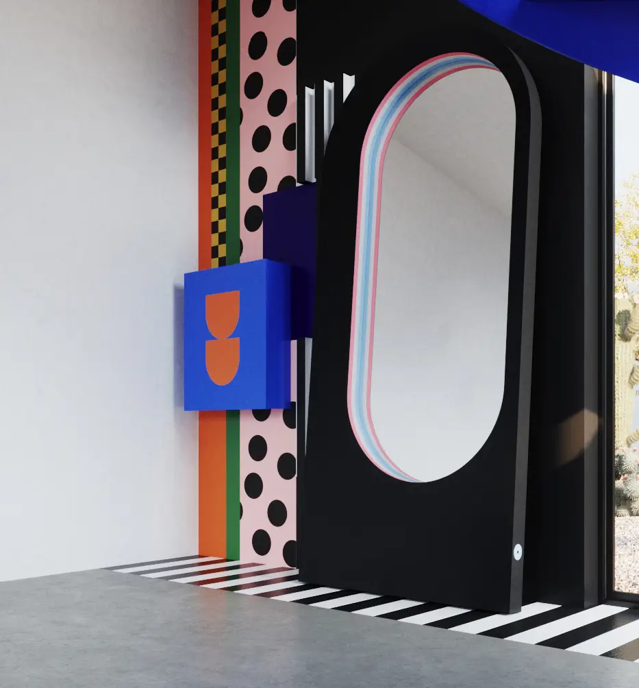 Czarne lustro łukowe w odważnej aranżacji Memphis z kolorowymi wzorami, niebieskimi schodami i czarno-białą podłogą