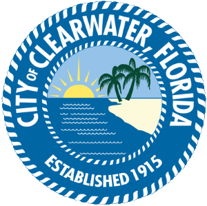Seal of Clearwater, Florida featuring a sun setting over water with palm trees on a sandy shore, surrounded by text and rope design.