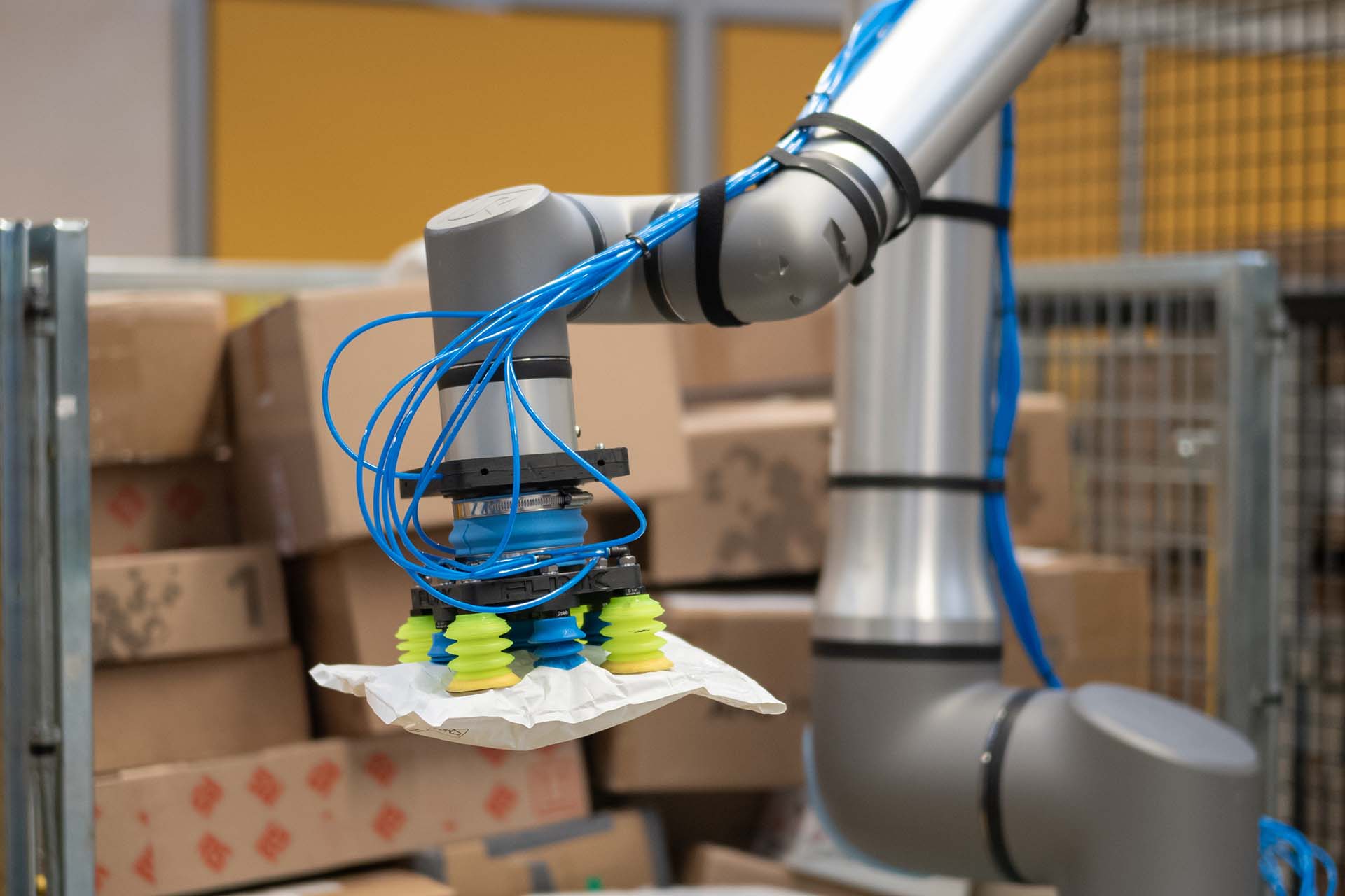 Flinkbot holding an awkwardly shaped parcel