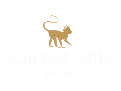 Logo of Kilkea Castle with a gold crowned monkey above the text Est 1180.