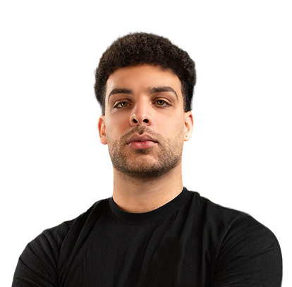 Portrait of a man with curly hair and beard wearing a black T-shirt against a black background.