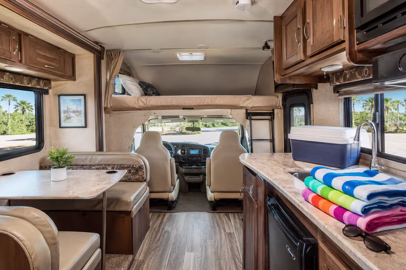 Class C motorhome interior with cab-over bunk