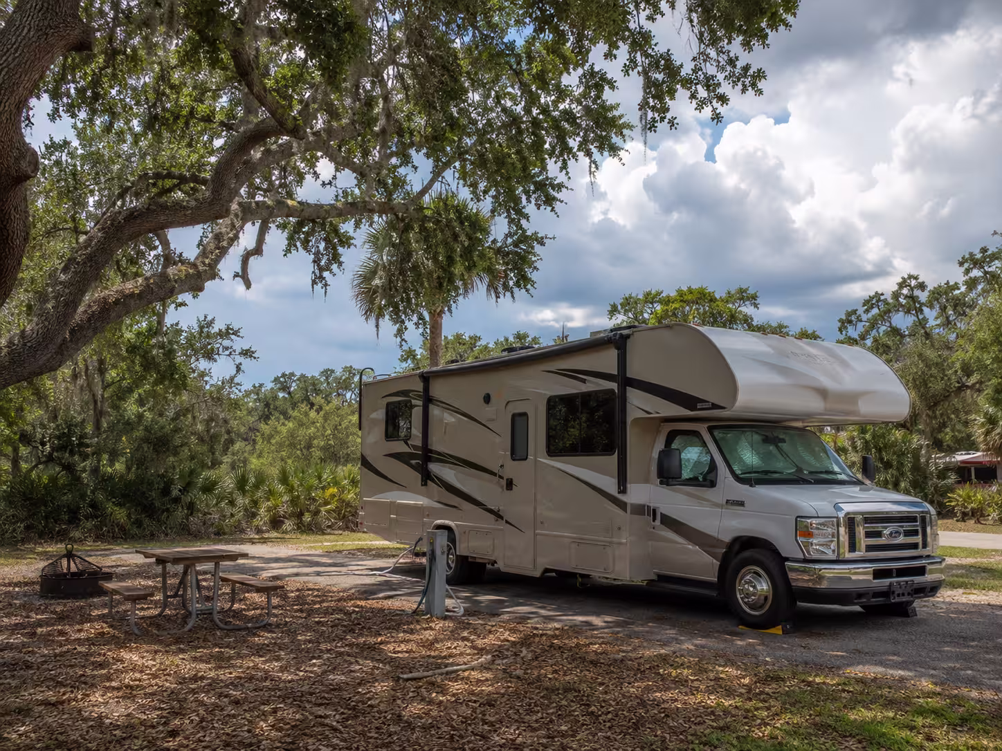 Class C motorhome at a campsite near Myakka River