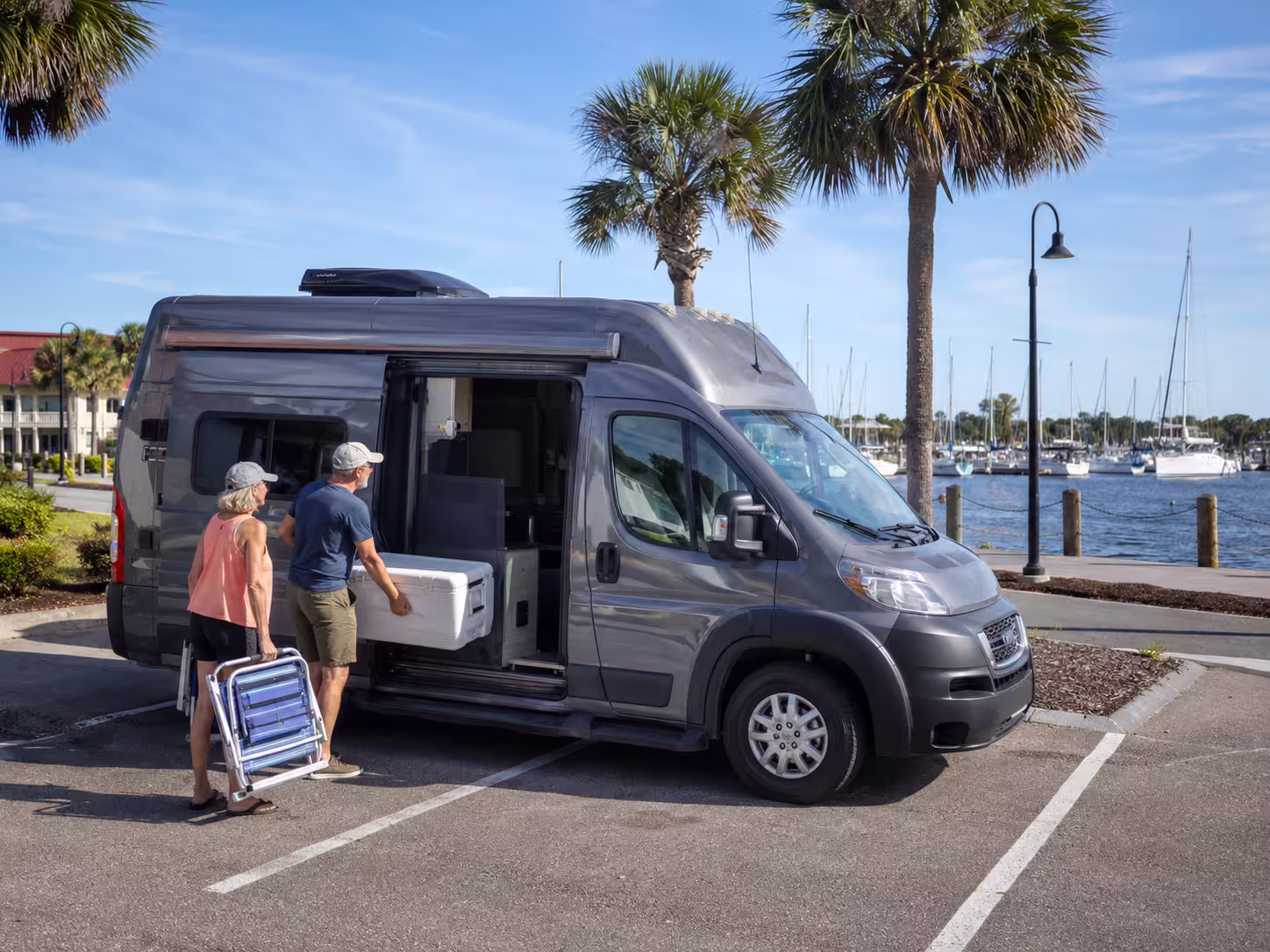 Small camper van rental parked near Charlotte Harbor in Punta Gorda
