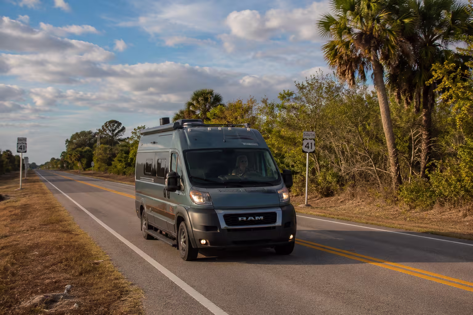 Small camper van driving US 41 near Punta Gorda, Florida