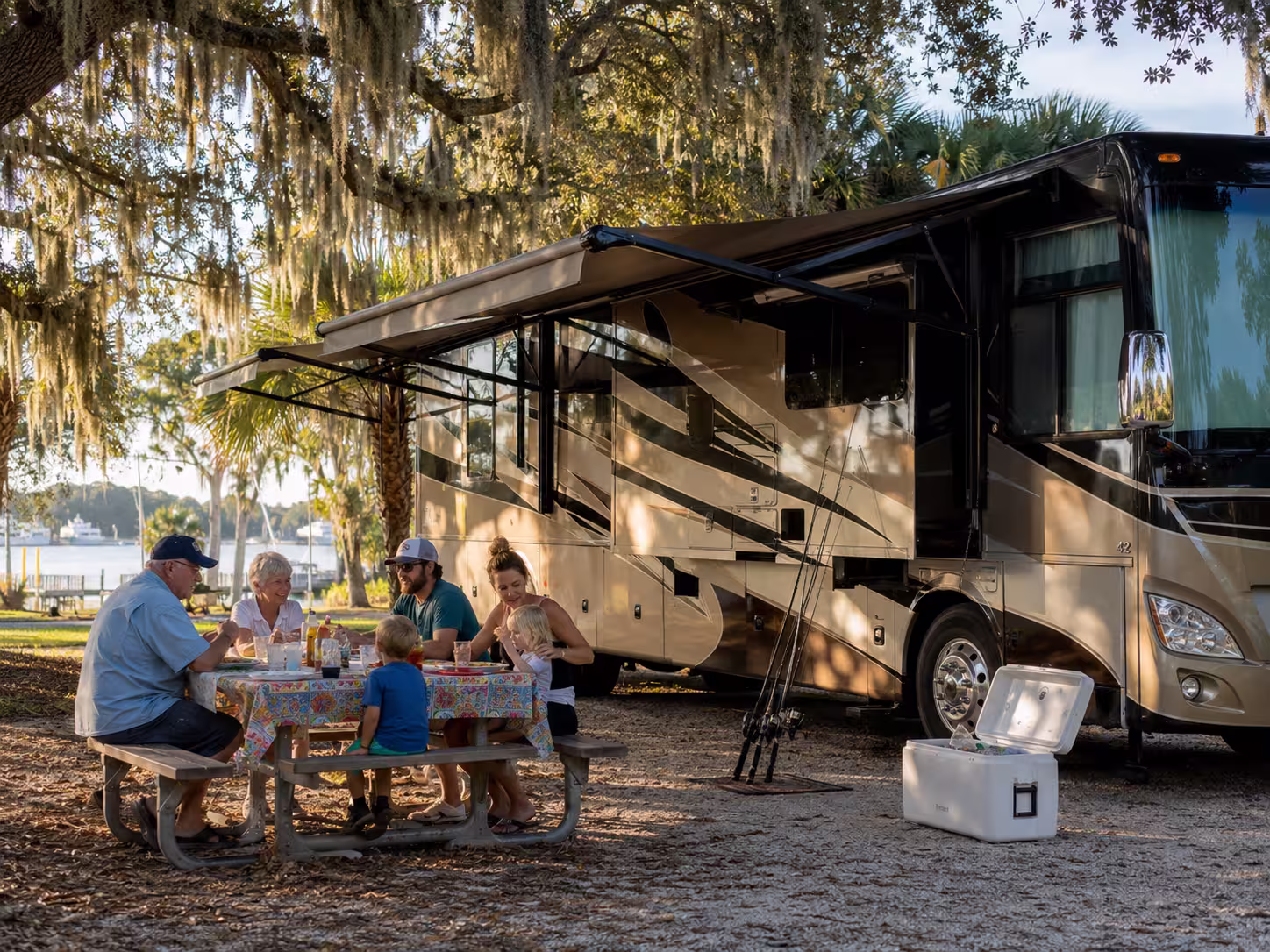 Family group beside a large motorhome rental near Charlotte Harbor