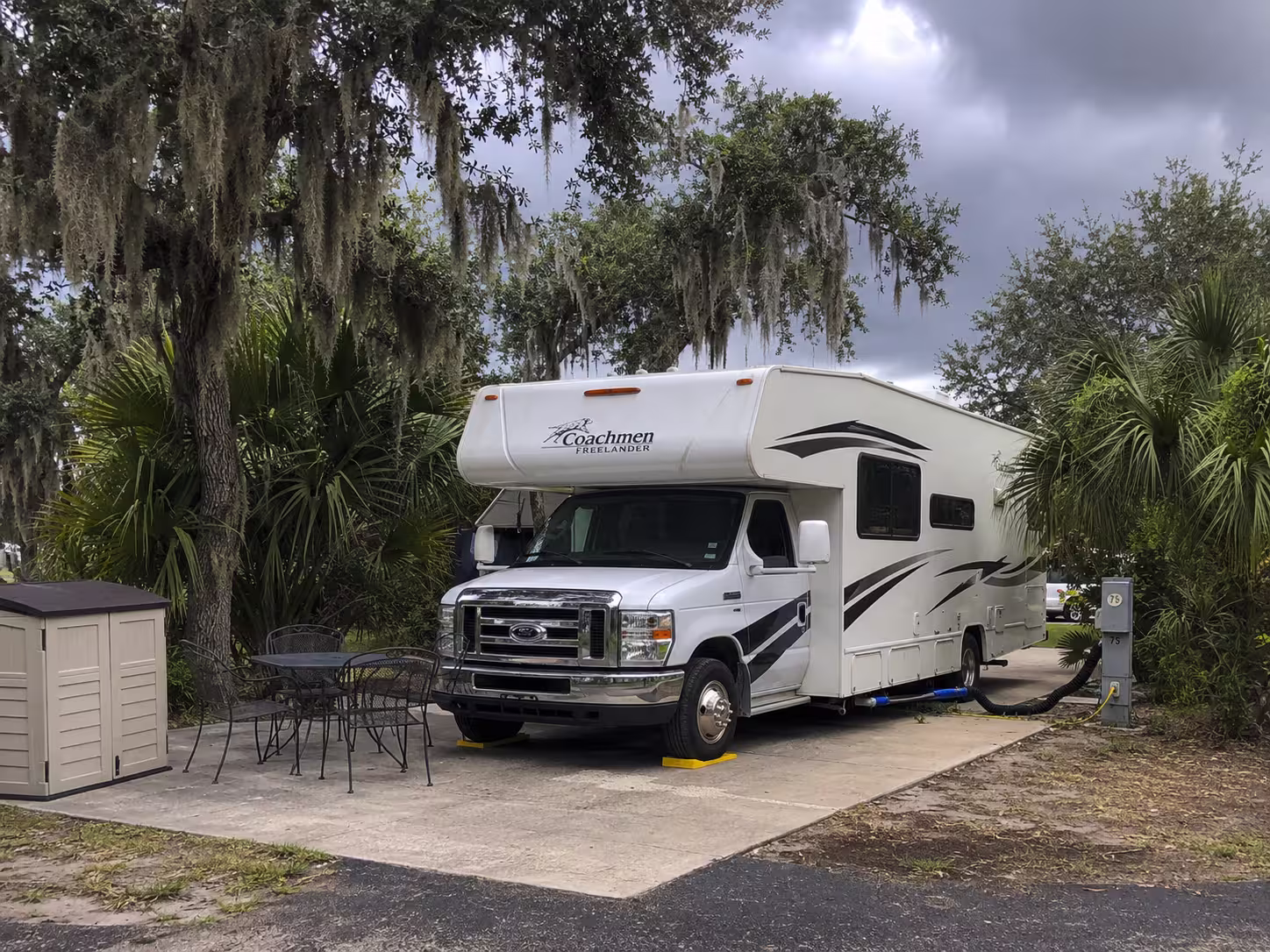 Class C motorhome on a long term hookup site in Charlotte County
