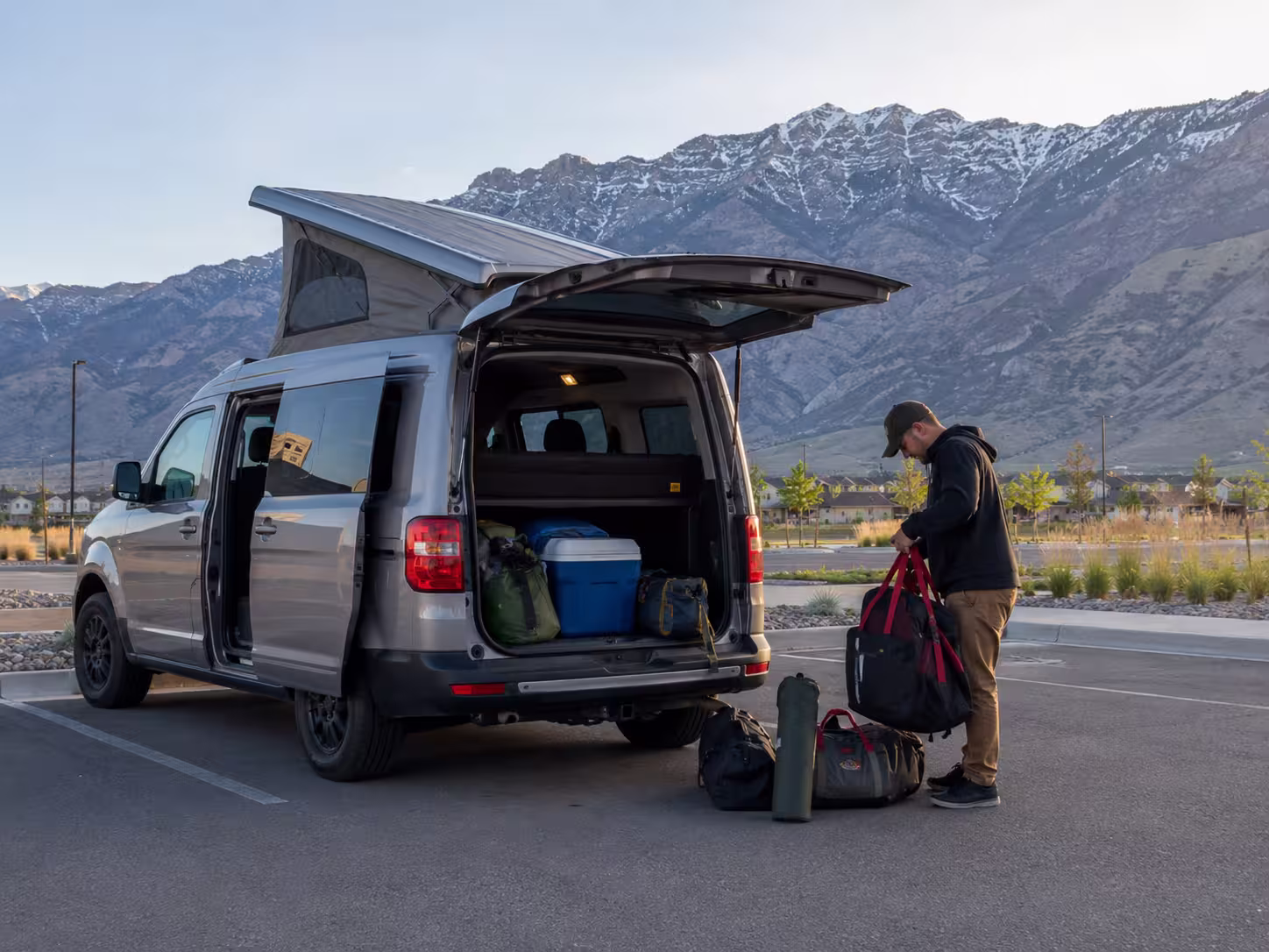 Small camper van RV rental in Salt Lake City with Wasatch mountains
