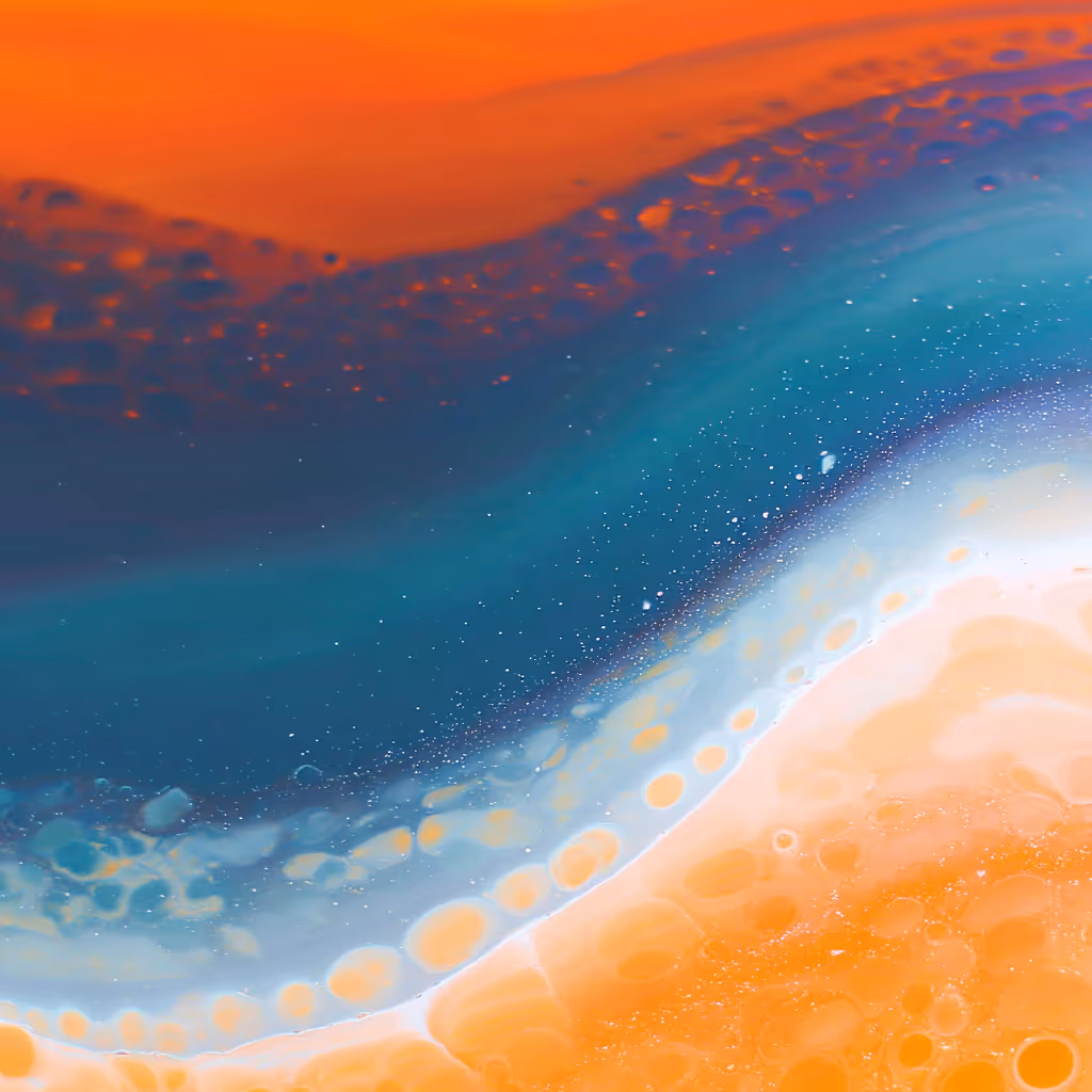 an abstract wave moving across the image with multiple colors of orange flowing into teal flowing into light blue and into yello-orange