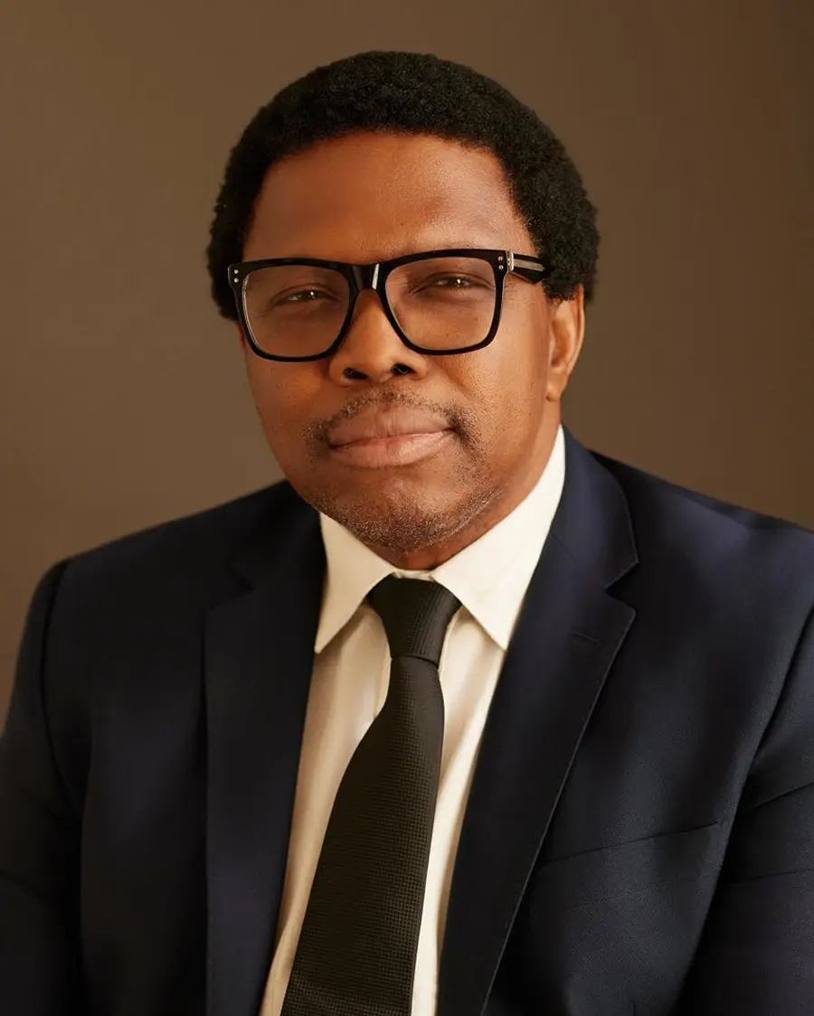 Image featuring A woman 2 Men and another woman all sitting across a table in an office meeting