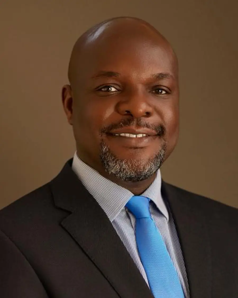 Image featuring A woman 2 Men and another woman all sitting across a table in an office meeting