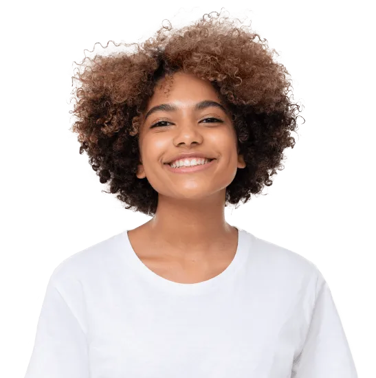 Smiling woman with curly hair wearing a white t-shirt on a white background.