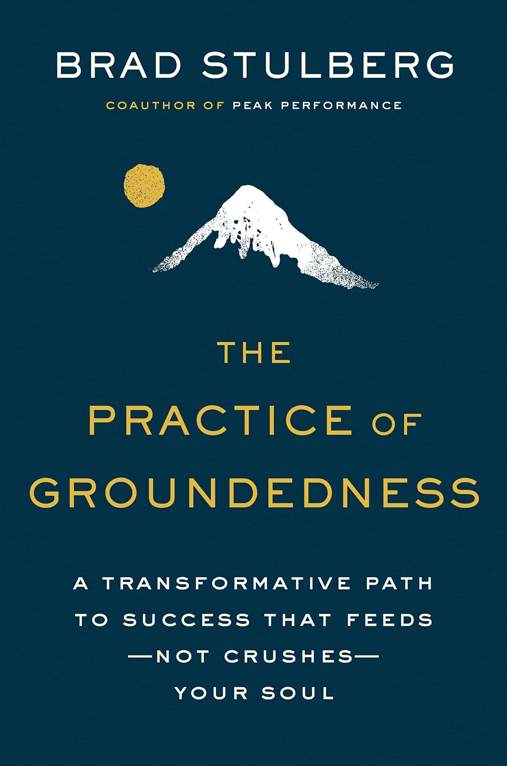 Book cover for The Practice of Groundedness by Brad Stulberg with a white mountain and gold sun illustration on a dark blue background.